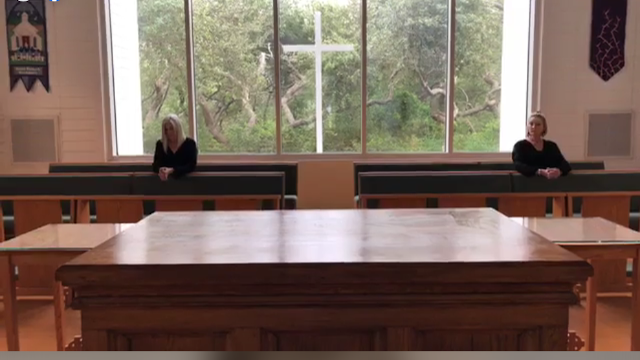Betty and Mary Catherine
		praying before stripped altar at conclusion of Maundy Thursday service
