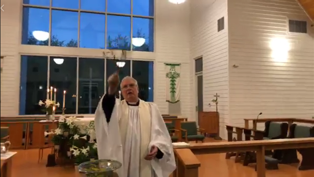 Fr. Jim blessing worship
		space during Vigil