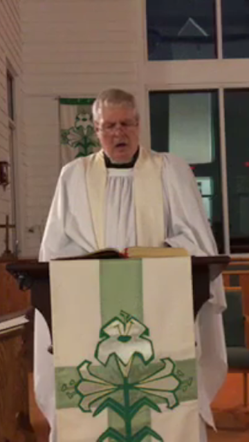 Fr. Jim singing
			at Easter Vigil